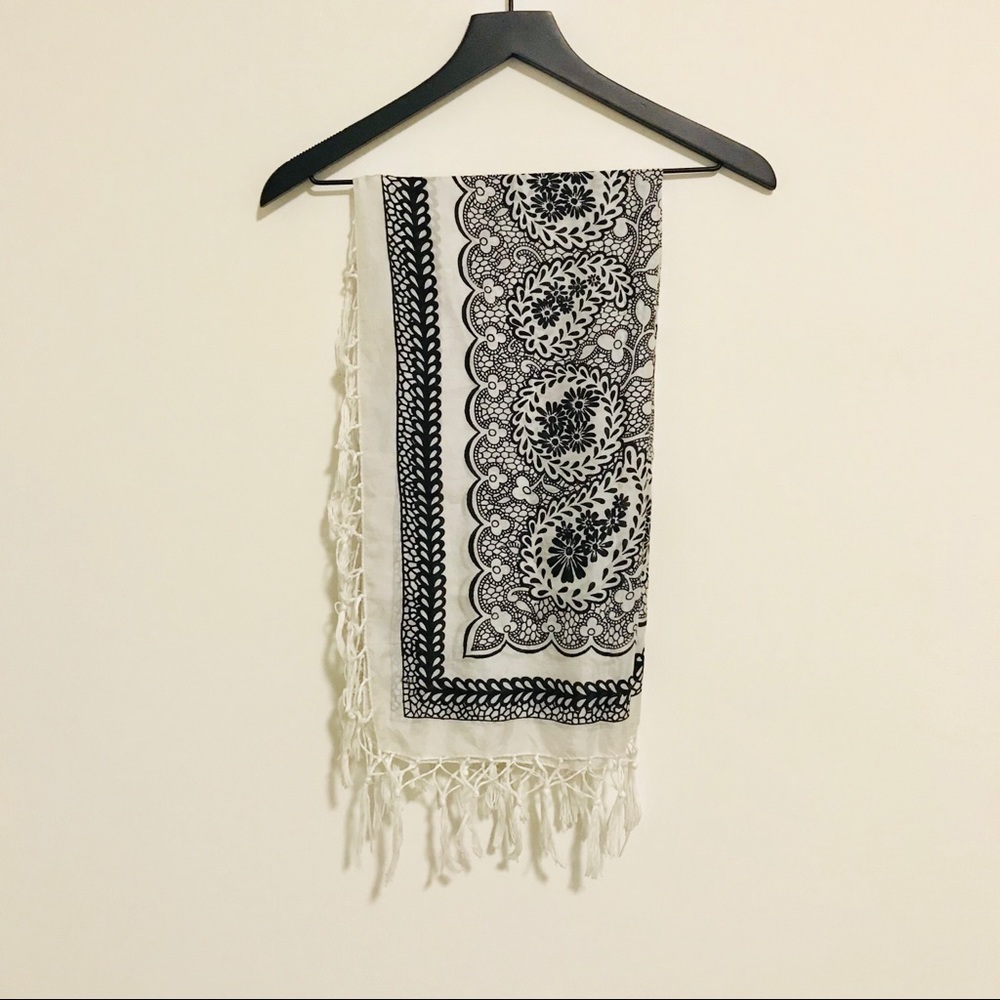 Silk large square scarf with tassel details.